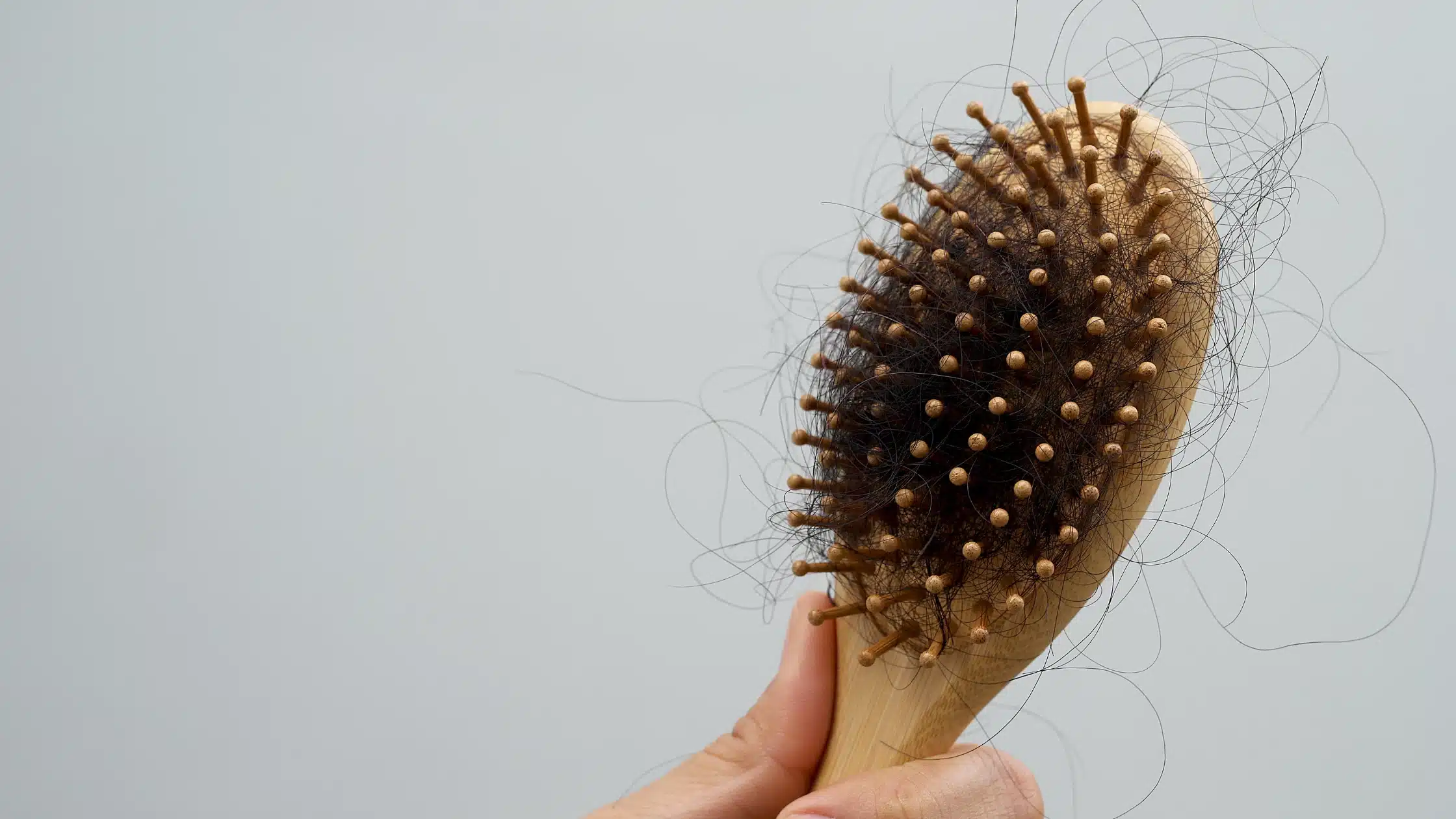 Why postpartum hair shedding happens — hormones, stress, nutrition and the hair growth cycle after birth